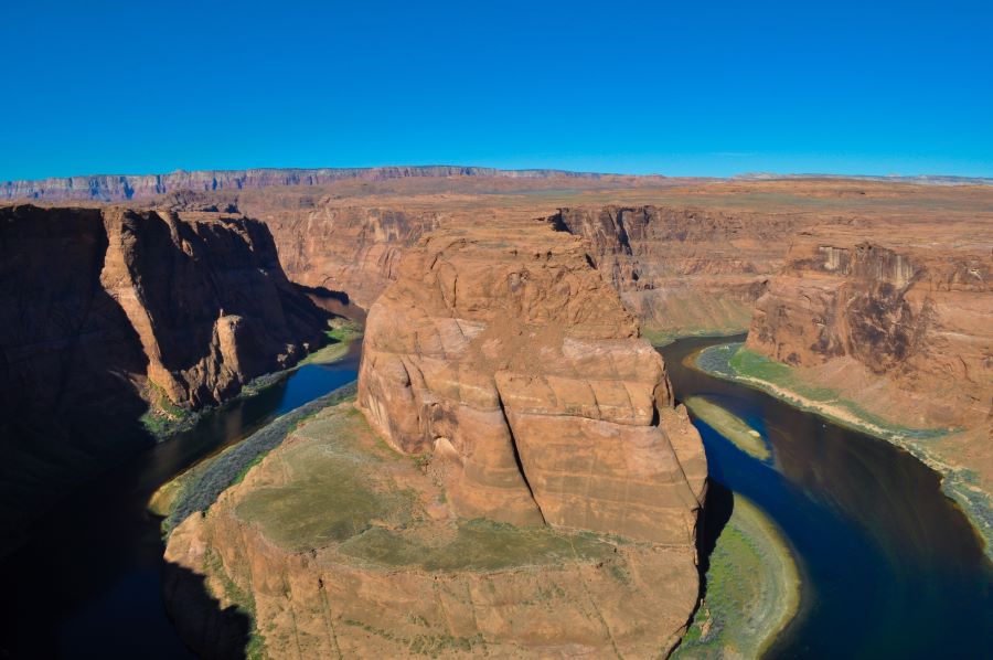 A wide, landscape shot of Horseshoe Bend featuring the Colorado River in Page, AZ.