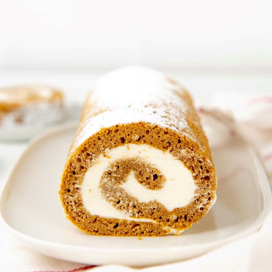 an image of a pumpkin roll with cream cheese filling in the middle.